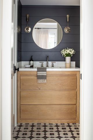Hoboken powder room with navy shiplap, oak vanity and patterned cement tile floor